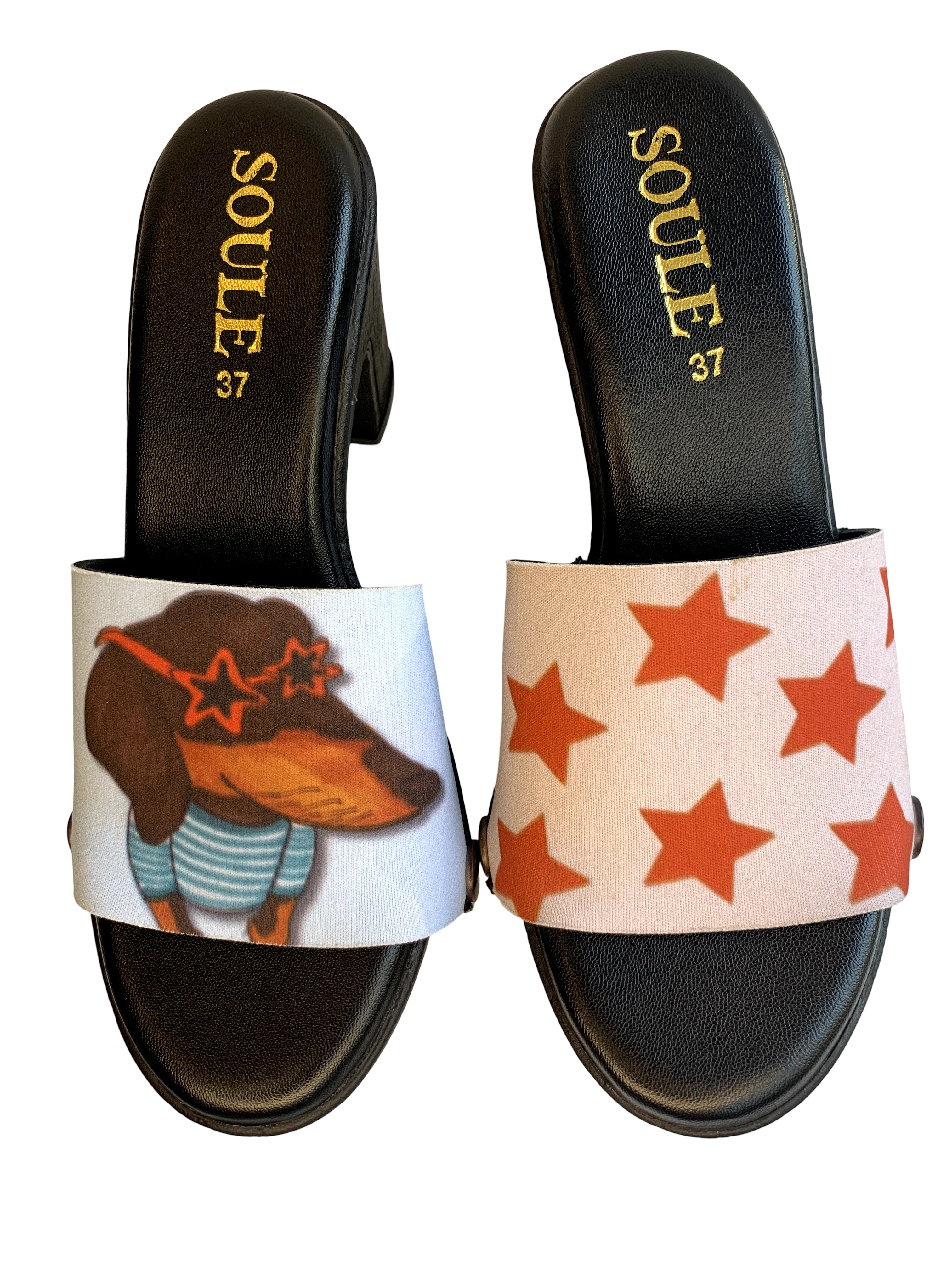 Dachshund Star snap-on shoe strap set close-up on black heel - illustrated dachshund in star sunglasses on sky blue and orange stars on cream by Soule