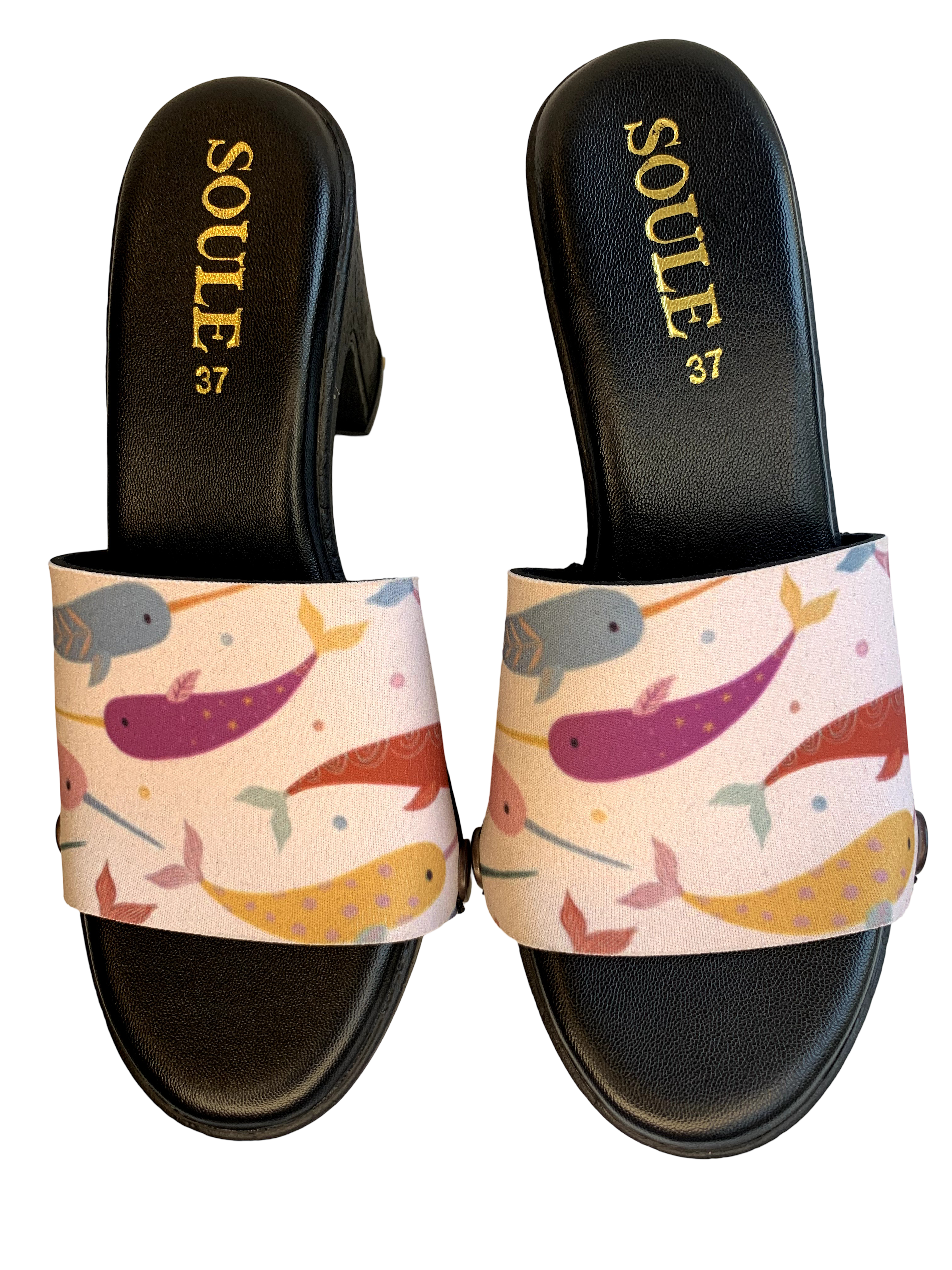Narwhal Dreams snap-on shoe strap set close-up on black heel - rainbow narwhals on soft cream by Soule