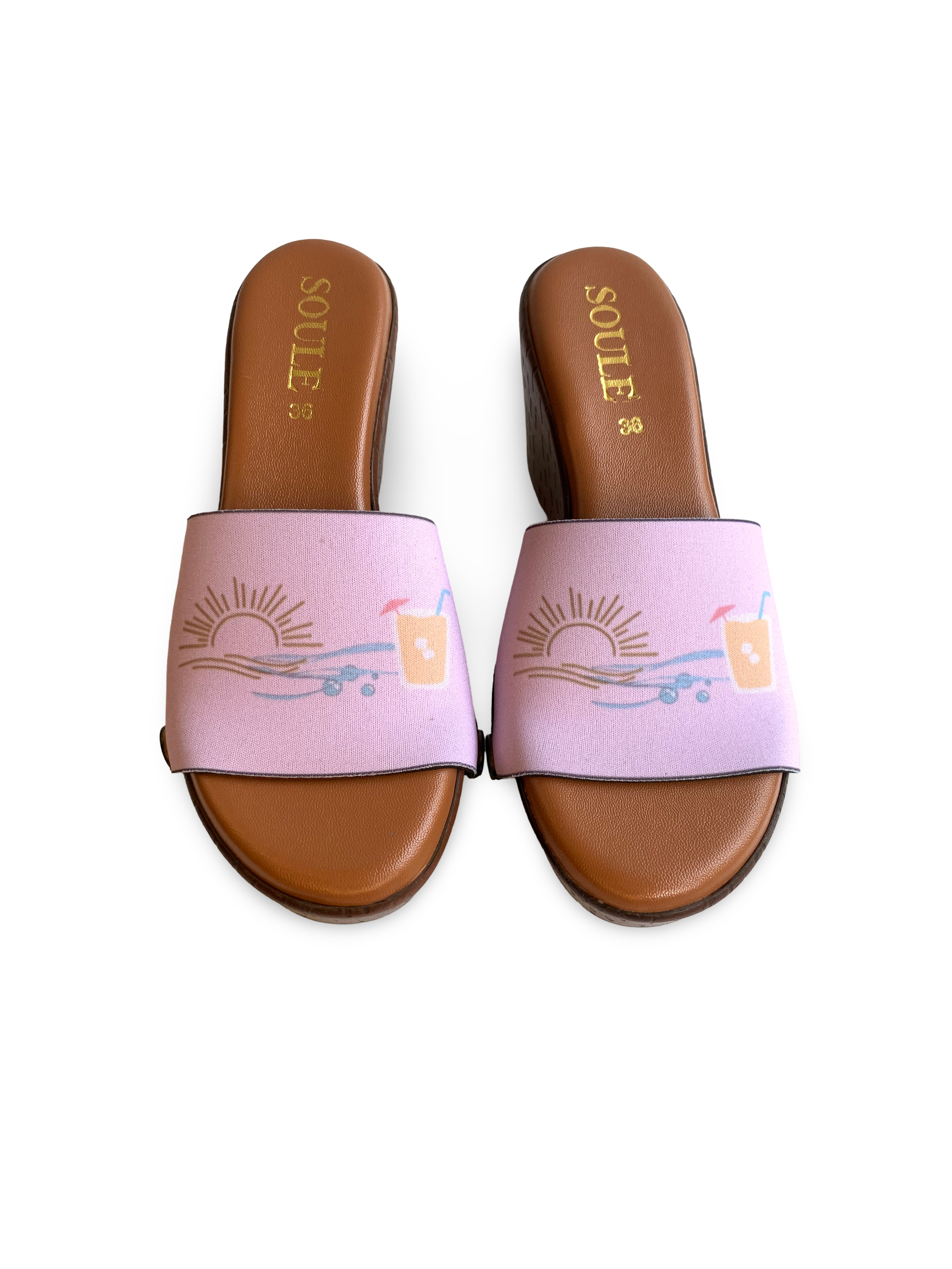 Close-up of Sunset interchangeable strap on brown wedge sole by Soule Footwear on white background