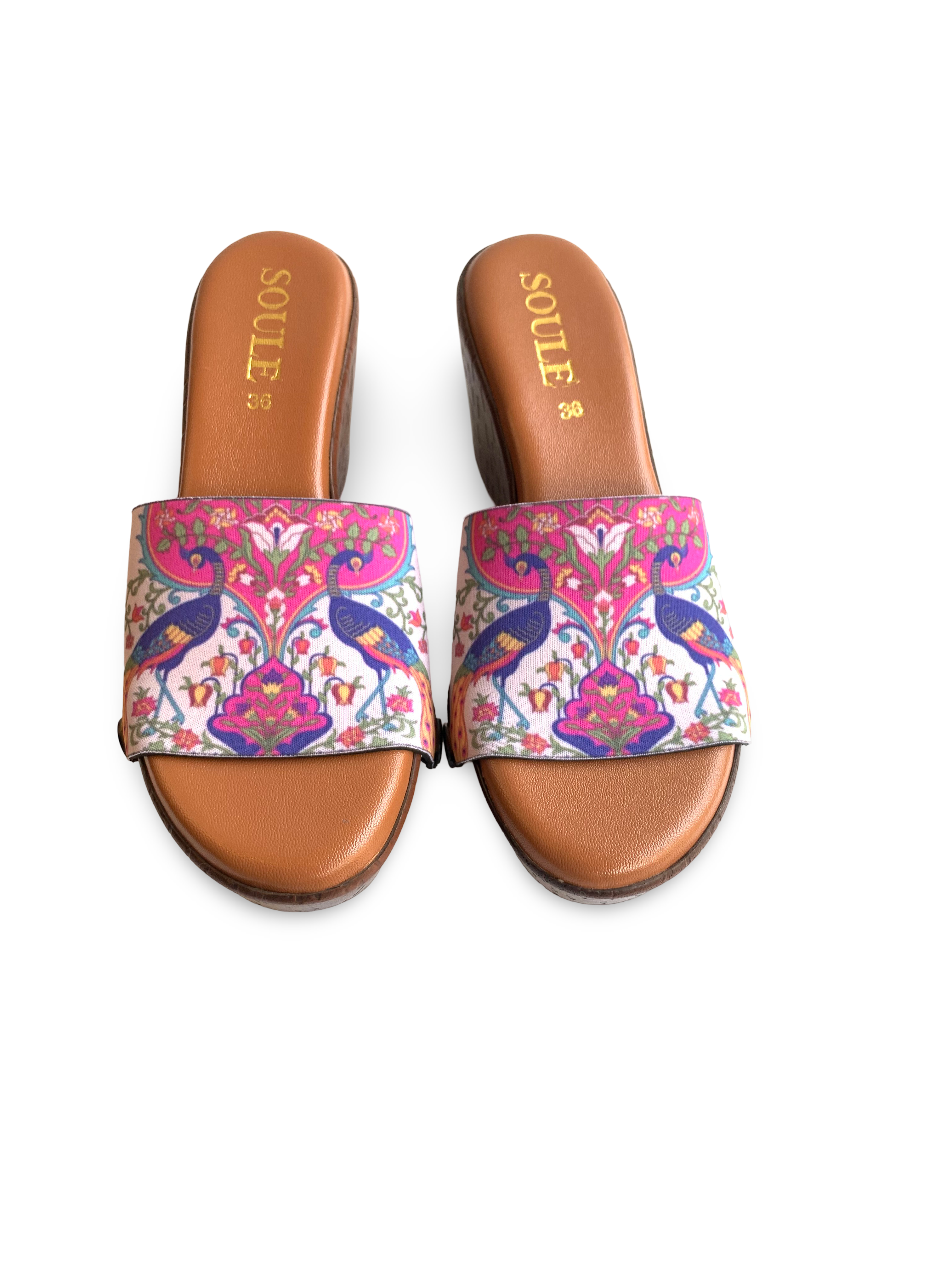 Close-up of Pichwai Peacock strap sandal — vibrant Mughal peacock print in cobalt blue, orange and magenta on cream brown wedge sole with black snap closures, by Soule Footwear