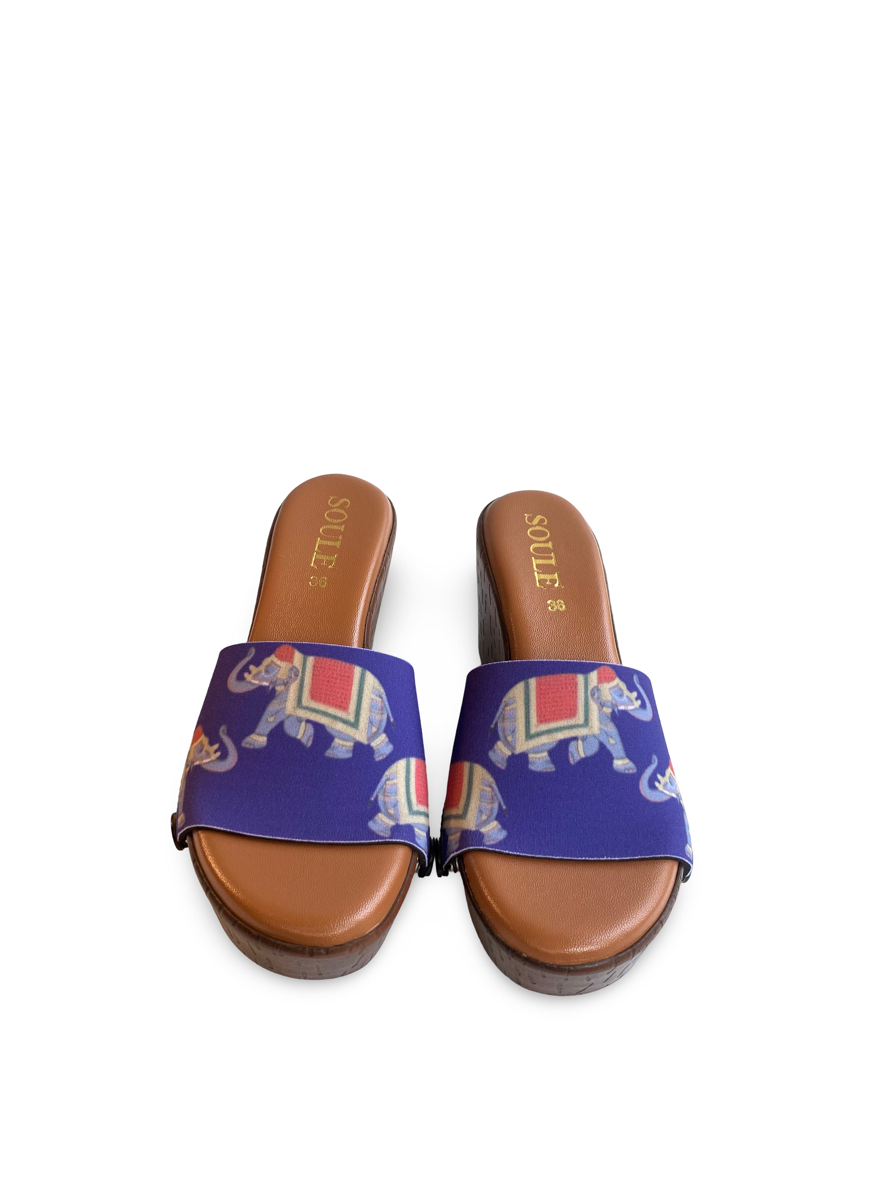 Royal Elephant snap-on shoe strap set close-up on cork wedge - ceremonial Indian elephant trunk raised on royal indigo by Soule