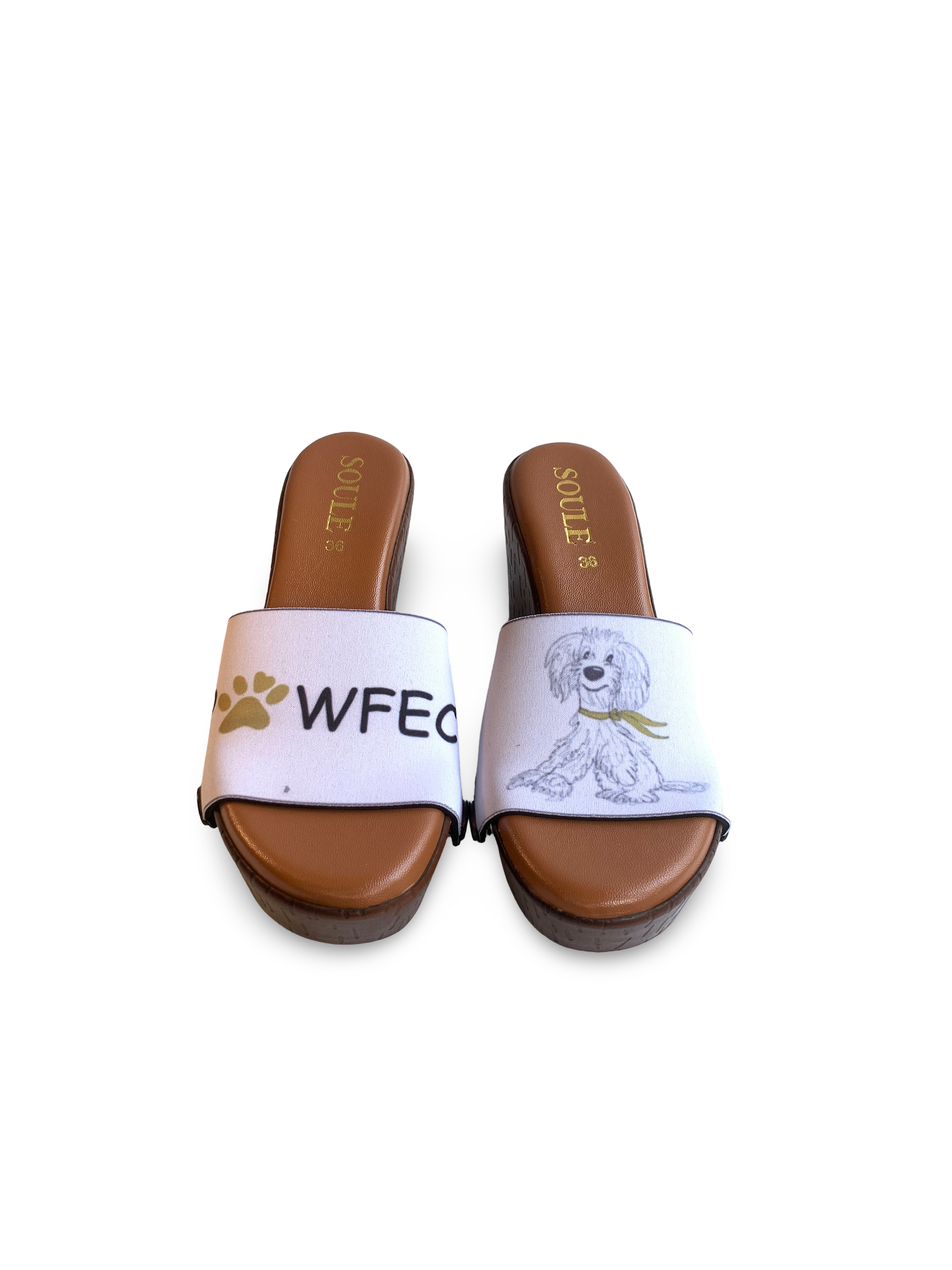 Pawfect snap-on shoe strap set close-up on cork wedge - watercolour fluffy white dog in yellow scarf and PAWFECT paw print lettering on white by Soule