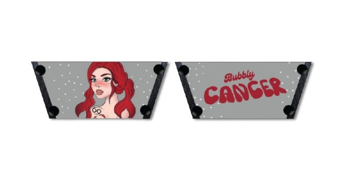 A pair of shoe straps with a red-haired cancer illustration and the word 'bubbly' and 'cancer' sun sign written on them by soule footwear