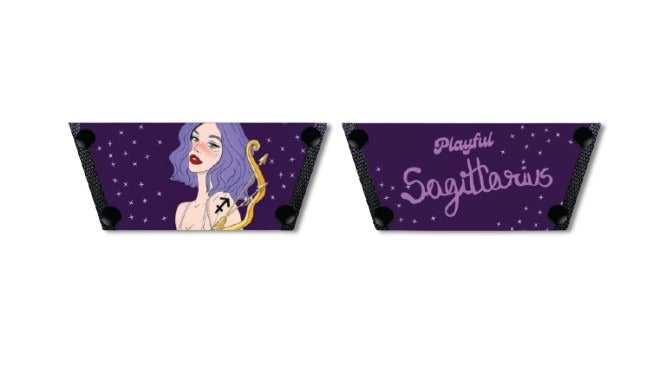 Close-up of cork wedge slide sandals with black snap clips and deep purple Playful Sagittarius zodiac strap with stars  by Soule Footwear